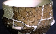 Bronocice clay pot showing wheeled cart. (Click on image to view larger.)
